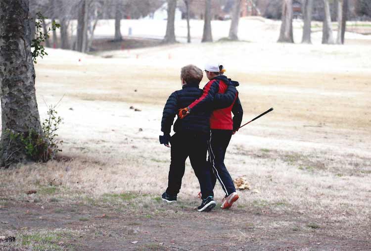 Slater Mobley golfing with a friend