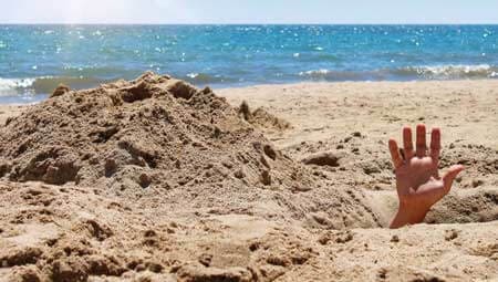 digging holes on beach