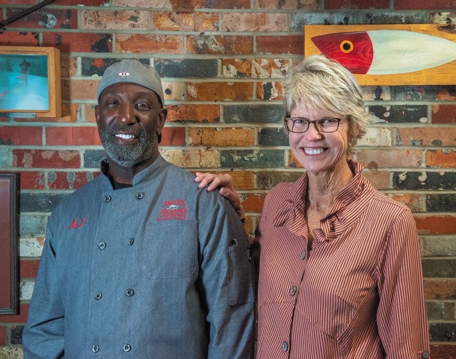 Awful Arthur's - Owner, Jo Whitehead with Chef AJ. Awful Arthur's is the only copper-topped oyster bar on the Outer Banks.