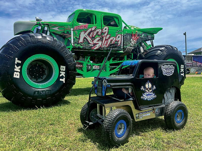 6-month-old, Halen Anderson in his customized Grave Digger wagon.
