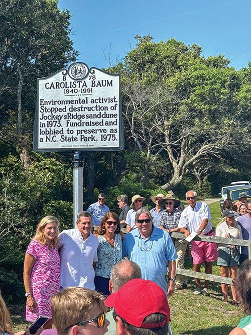 Ann-Cabell Baum, Gibbs Baum, Inglis Baum Walsh and George Barnes pose for a photo with the new sign to mark the occasion. More crowds will gather in June to celebrate the official 50th anniversary of Jockey's Ridge becoming a North Carolina State Park. Photos submitted by Ann-Cabell Baum.
